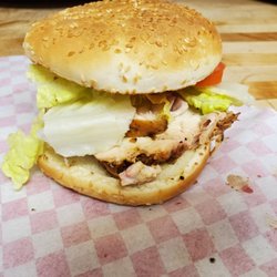 Lite Em Up BBQ - Chicken sandwich with tomato and lettuce.