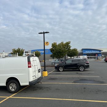 Walmart Supercenter - a white van in a parking lot - Grocery Near Me - Manassas, Virginia