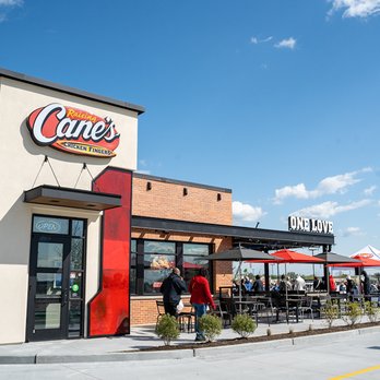 Raising Cane's Chicken Fingers - the outside of a restaurant - Chicken Shop Near Me - Harlingen, Texas Raising Cane's Chicken Fingers - the outside of a restaurant - Chicken Shop Near Me - Harlingen, Texas