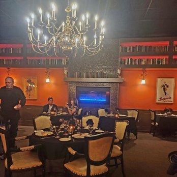 Library Restaurant - a group of people sitting around a dining table - French Near Me - Myrtle Beach, South Carolina Library Restaurant - a group of people sitting around a dining table - French Near Me - Myrtle Beach, South Carolina