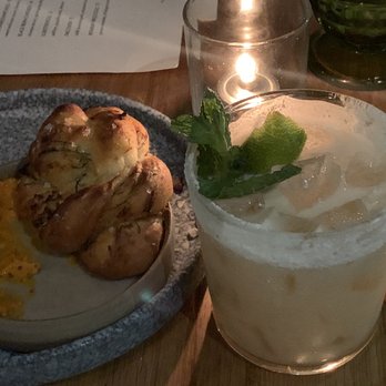 Houndstooth Restaurant - Carmelized fennel buns with salami spread & Lizzy's Ladder cocktail - New American Near Me - Benton Harbor, Michigan