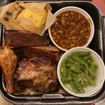 Sonny's BBQ - St. Louis dry rub ribs, green beans (half eaten), baked beans, chicken drumstick, corn bread - Barbeque Near Me - Wesley Chapel, Florida