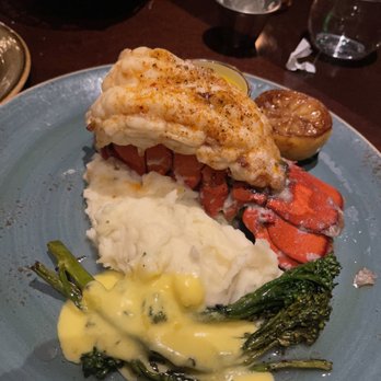 Portico by Fabio Viviani - 9 oz. Maine lobster tail, asparagus (replaced with broccolini) w/ hollandaise sauce, garlic herb whipped mashed potatoes - Italian Near Me - Waterloo, New York Portico by Fabio Viviani - 9 oz. Maine lobster tail, asparagus (replaced with broccolini) w/ hollandaise sauce, garlic herb whipped mashed potatoes - Italian Near Me - Waterloo, New York