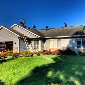 Briggs Family Home Development - workers on the roof - General Contractors Near Me