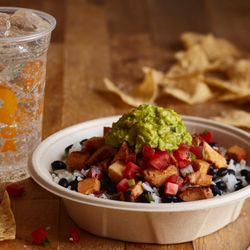 QDOBA Mexican Eats - A burrito bowl topped with freshly grilled adobo chicken brings the flavor!