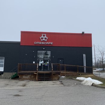 Omventure - the outside of a building with a red and black exterior - Cafes Near Me - Markham, Ontario