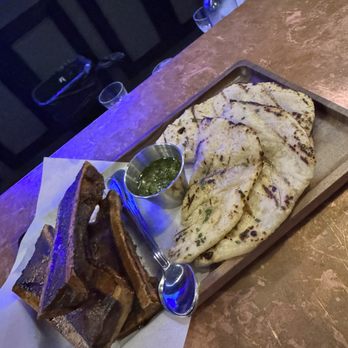 Lechon - Smoked Bone Marrow With Gaucho Bread* - Tapas Bars Near Me - Portland, Oregon Lechon - Smoked Bone Marrow With Gaucho Bread* - Tapas Bars Near Me - Portland, Oregon