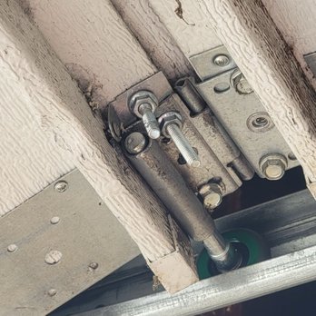 Precision Garage Door - Two bolts added to hold one of the door panels in place since whatever was used prior disconnected somehow - Garage Door Services Near Me - San Jose, California Precision Garage Door - Two bolts added to hold one of the door panels in place since whatever was used prior disconnected somehow - Garage Door Services Near Me - San Jose, California