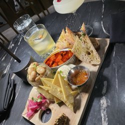 MoonCloud - Golden milk punch(left) and Empire Strikes Back(right) Pickled onion, White bean with rice crackers, gouda, octopus, sourdough toast