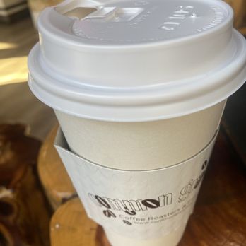 Common Grounds - a cup of coffee on a table - Coffee & Tea Near Me - New Haven, Connecticut