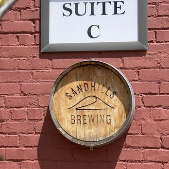 Sandhills Brewing - a sign on a brick wall - Breweries Near Me - Hutchinson, Kansas Sandhills Brewing - a sign on a brick wall - Breweries Near Me - Hutchinson, Kansas