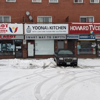 Yoona's Kitchen - From the sidewalk across the parking lot looking at the store in the plaza. Feb 2021 - Bakeries Near Me - Toronto, Ontario
