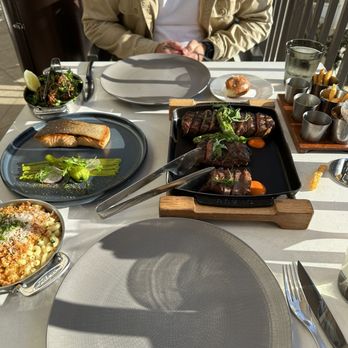 Bourbon Steak Orange County - Steak sampler, truffle Mac and cheese, broccolini, salmon, complimentary fries. - Steakhouses Near Me - Dana Point, California