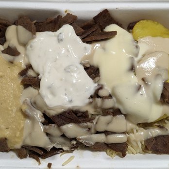 Pita Lite - Beef gyros on rice, with potatoes, hummus, garlic, tzatziki, and tahini sauces. It's BOGO on Uber Eats. - Mediterranean Near Me - Mississauga, Ontario Pita Lite - Beef gyros on rice, with potatoes, hummus, garlic, tzatziki, and tahini sauces. It's BOGO on Uber Eats. - Mediterranean Near Me - Mississauga, Ontario