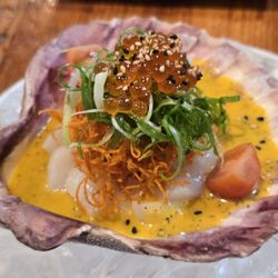 Mistura Restaurant - "Apasionada" - scallop tiradito, passion fruit leche de Tigre and a touch of Aji Limo. Served over ice, with smoking dry ice.
