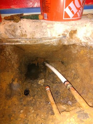 Repaired Water line Slab Leak - We busted out the concrete and repair this slab leak. In the images it shows the progress of the repair.