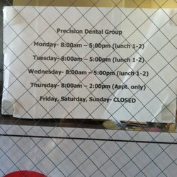 Precision Dental Group - Hours are also listed on machine .