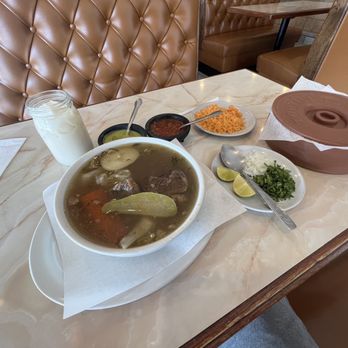 Taqueria La Carreta - a table with soup and condiments - Mexican Near Me - Franklin Park, Illinois Taqueria La Carreta - a table with soup and condiments - Mexican Near Me - Franklin Park, Illinois