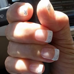White tips with a splash of glitter.