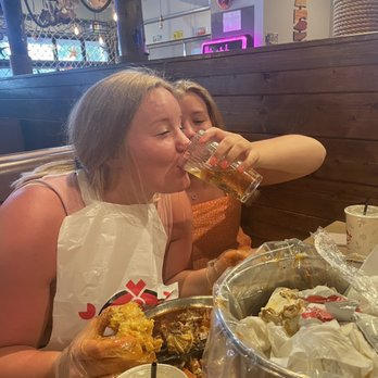 Mr. & Mrs Crab - So messy that help was needed to drink the $1 beers. - Seafood Near Me - Bradenton, Florida