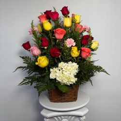 La Guadalupana Flowers & Gifts - Elegant basket arrangement with multicolor roses, white hydrangea, pink carnations, and lush greenery, perfect for birthdays, sympathy, and