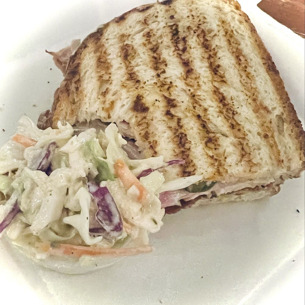 Uncle Cam’s - Half of The Cam sandwich with a side of slaw and chips (not shown). - Sandwiches Near Me Uncle Cam’s - Half of The Cam sandwich with a side of slaw and chips (not shown). - Sandwiches Near Me
