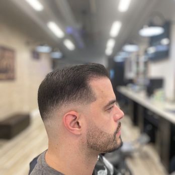 Upper Cuts Barbershop - Mid skin fade with a beard line up - Barbers Near Me - Miami, Florida Upper Cuts Barbershop - Mid skin fade with a beard line up - Barbers Near Me - Miami, Florida