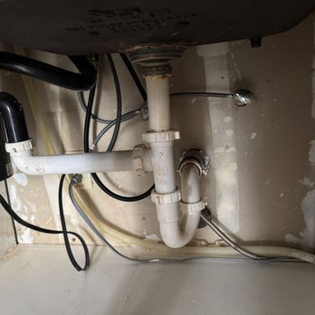 Letts Plumbing - BEFORE: leaking garbage disposal; plastic drain pipes in poor condition as well as the seal to basket strain. Needs new air gap. - Plumbing Near Me Letts Plumbing - BEFORE: leaking garbage disposal; plastic drain pipes in poor condition as well as the seal to basket strain. Needs new air gap. - Plumbing Near Me