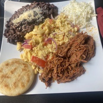 Astor’s Table - KatyZuelan breakfast plate of shredded beef, tomato and onion eggs, black beans and an arepa - Steakhouses Near Me - Katy, Texas