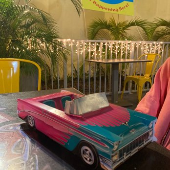 The Burger Place - a pink and blue car on a table - Burgers Near Me - Melbourne, Florida The Burger Place - a pink and blue car on a table - Burgers Near Me - Melbourne, Florida