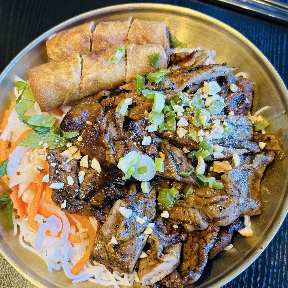 Grilled pork, noodles and veggies. Grilled pork, noodles and veggies.