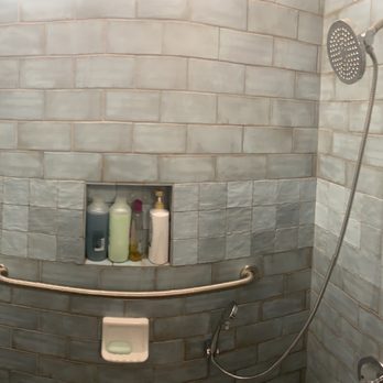 Romero Enterprise - Bar to help me stand up. He created a shelf to put shampoo and conditioner in. David also put in new fixtures everywhere. - General Contractors Near Me