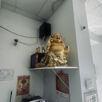 Wan Jia Le Supermarket - a shelf with a statue of a buddha on it - International Grocery Near Me - El Paso, Texas Wan Jia Le Supermarket - a shelf with a statue of a buddha on it - International Grocery Near Me - El Paso, Texas