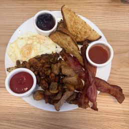 Traditional breakfast. One with biscuits and chorizo sausage. The other with white bread and bacon. Traditional breakfast. One with biscuits and chorizo sausage. The other with white bread and bacon.