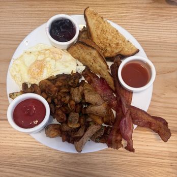 The Sleepy Rooster - Traditional breakfast. One with biscuits and chorizo sausage. The other with white bread and bacon. - New American Near Me - Chagrin Falls, Ohio The Sleepy Rooster - Traditional breakfast. One with biscuits and chorizo sausage. The other with white bread and bacon. - New American Near Me - Chagrin Falls, Ohio