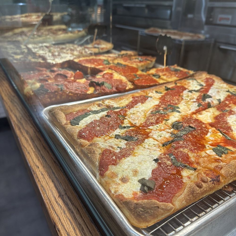 Donatina Neapolitan Pizza Cafe - The pizza looks delicious behind the counter UNBELIEVABLE - Pizza Near Me - Patchogue, New York Donatina Neapolitan Pizza Cafe - The pizza looks delicious behind the counter UNBELIEVABLE - Pizza Near Me - Patchogue, New York