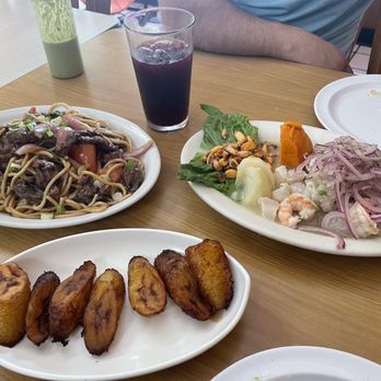 Asumare - Left to right: tallarÃn de carne (noodles), ceviche mixto (raw seafood mix), yucca frita (fried plantain) - Peruvian Near Me - San Fernando, California Asumare - Left to right: tallarÃn de carne (noodles), ceviche mixto (raw seafood mix), yucca frita (fried plantain) - Peruvian Near Me - San Fernando, California