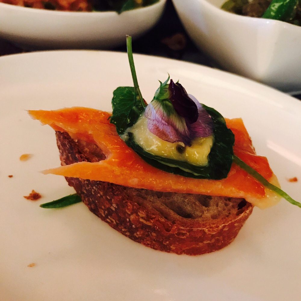 Harvest Table - Bite of smoke trout on top of bread - New American Near Me - St Helena, California Harvest Table - Bite of smoke trout on top of bread - New American Near Me - St Helena, California