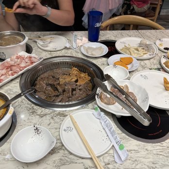 Master Ba's Hot Pot & BBQ - Spread of grilled meats including Short Rib, Lamb, and Chicken, Crab Wontons, Calamari, Dumplings, and Spicy Hot Pot with Sweet Potato - Hot Pot Near Me - Sunrise, Florida Master Ba's Hot Pot & BBQ - Spread of grilled meats including Short Rib, Lamb, and Chicken, Crab Wontons, Calamari, Dumplings, and Spicy Hot Pot with Sweet Potato - Hot Pot Near Me - Sunrise, Florida