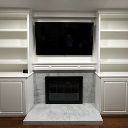 Custom wall unit with fireplace surround.