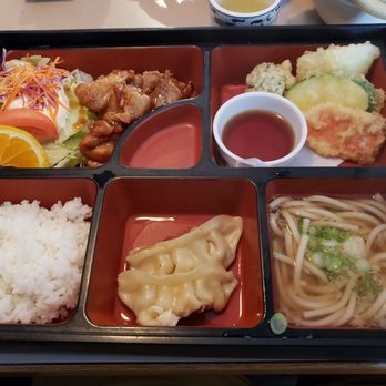 Hakata Restaurant - Lunch bento box. Spicy chicken, vegetable tempura, udon, gyoza, rice, salad. Really great deal. - Japanese Near Me - Silverdale, Washington