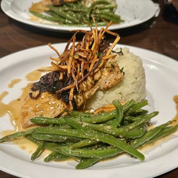 Odeh’s Mediterranean Kitchen - Citrus bourbon glazed salmon topped with carmelized onions and carrot straws. 1/20/24 - Mediterranean Near Me - High Point, North Carolina Odeh’s Mediterranean Kitchen - Citrus bourbon glazed salmon topped with carmelized onions and carrot straws. 1/20/24 - Mediterranean Near Me - High Point, North Carolina
