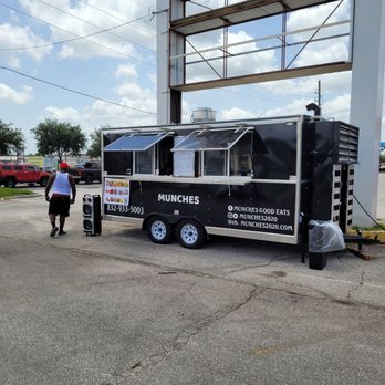 Munches Good Eats - a man standing next to a food truck - Food Trucks Near Me - Houston, Texas