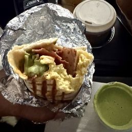 The a.m breakfast burrito and signature green sauce that I devoured in my car.