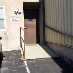 Paula Risley's Auto Tags - Handicap Ramp Entrance on the side of the building.