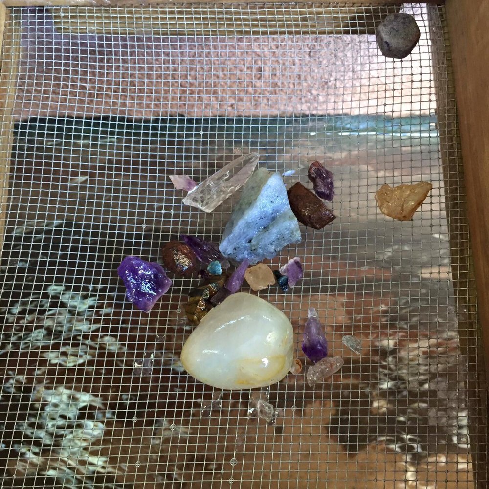 Just one pan of what we found in our bucket. Look at the huge Topaz! Just one pan of what we found in our bucket. Look at the huge Topaz!