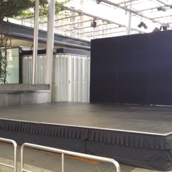 Pro AV Rentals - Stage rental with pipe and drape with black drapes.
