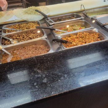 Pancheros Mexican Grill - Moosic - a person preparing food - Mexican Near Me - Moosic, Pennsylvania Pancheros Mexican Grill - Moosic - a person preparing food - Mexican Near Me - Moosic, Pennsylvania