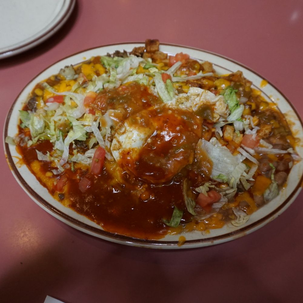 Sadie's - Stacked enchilada with Christmas style chiles and an egg on top. - New Mexican Cuisine Near Me - Albuquerque, New Mexico Sadie's - Stacked enchilada with Christmas style chiles and an egg on top. - New Mexican Cuisine Near Me - Albuquerque, New Mexico