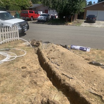 Repipe Specialists - Seattle - Red cedar plumbing dig like 15 inches deep and like 70 feet to install a new Pex A main water line pipe from the water meter. - Plumbing Near Me Repipe Specialists - Seattle - Red cedar plumbing dig like 15 inches deep and like 70 feet to install a new Pex A main water line pipe from the water meter. - Plumbing Near Me